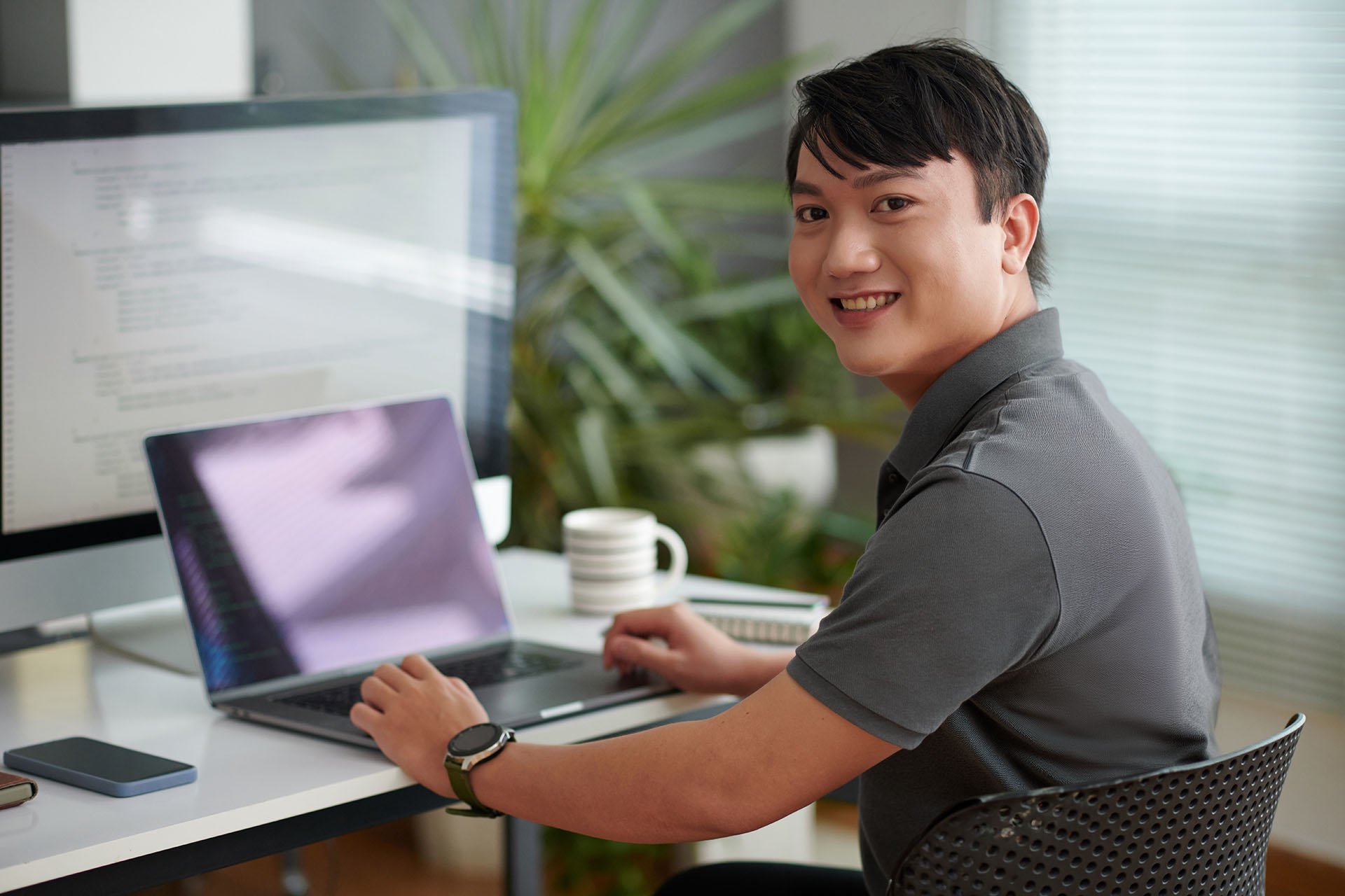 cheerful-asian-software-developer