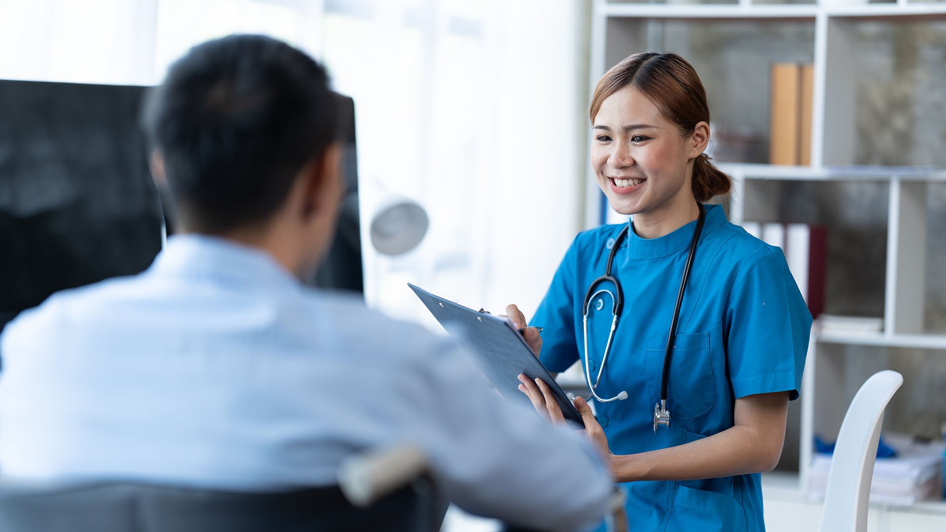 doctor-and-patient-sitting-and-talking-at-medical