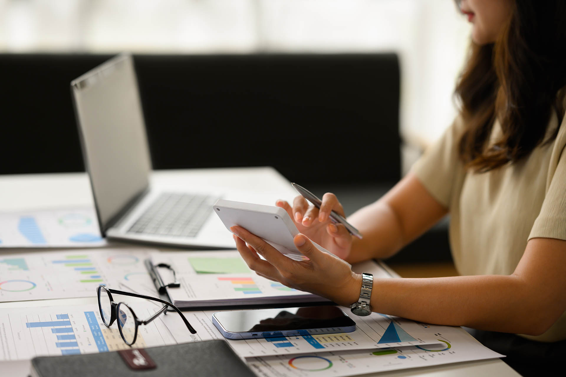 cropped-shot-of-female-accountant-working-bookkeeper
